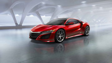 Vista en ángulo delantero del icónico Honda NSX en rojo, mostrando su diseño aerodinámico.