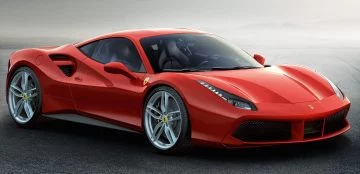 Vista lateral Ferrari 488 en tono rojo vibrante, diseño aerodinámico.