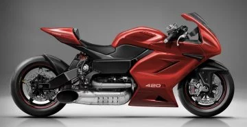 Motocicleta deportiva roja con asiento negro y diseño aerodinámico.