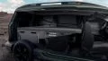 Vista lateral interna Dacia Jogger adaptada a camper, destacando funcionalidad y espacio.