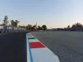 Curva con los icónicos pianos de Monza, manteniendo la esencia histórica del circuito.